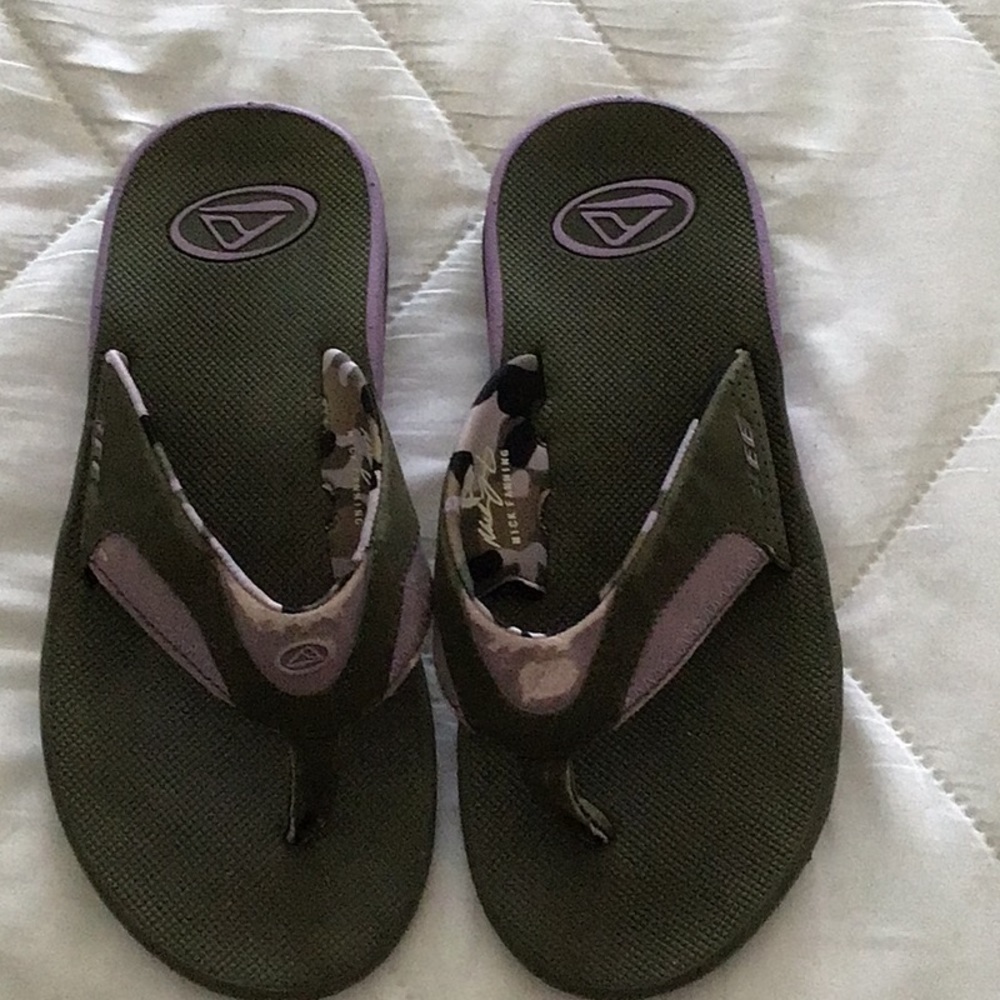 Reef sandals with bottle opener on sole